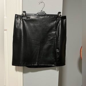 Divided black skirt size 14, made of synthetic leather